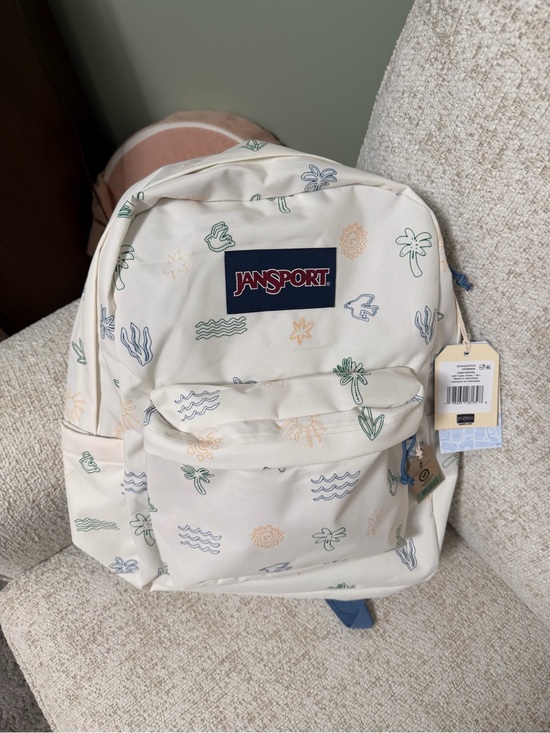 Jansport Handbags - JanSport Cream Backpack with Blue Logo and Pastel Tropical Motifs